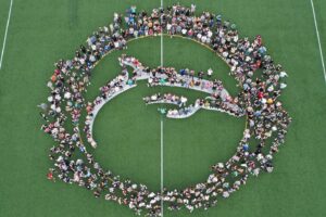 Students forming a Dolphin