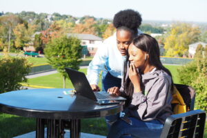 Students helping each other apply for financial aid