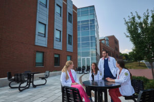 PA Students around a table outside of the Science Center at Le 69ɫ����Ƶ College