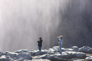Students photographing waterfalls in Iceland.