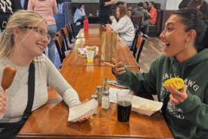 Students laughing over a meal