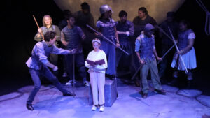 Ensemble cast performing in Beowulf