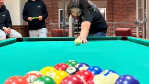 Student playing pool