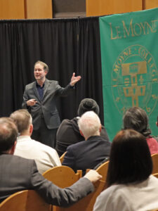 Michael T. Rizzi, Ph.D. speaks to a full chapel